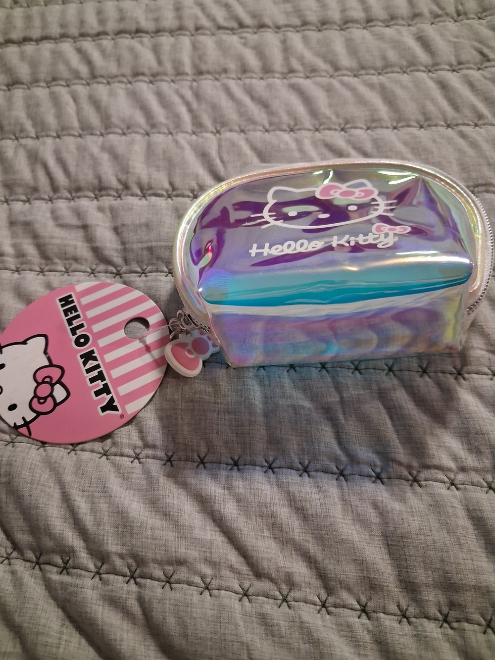 Hello Kitty Iridescent Mini Pouch with Pink Charm
